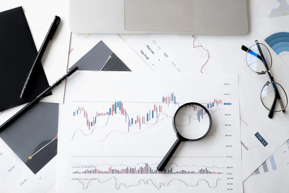Adviser reviewing figures on a printed report